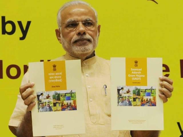 आदर्श ग्राम योजना: 'गुजरात के सांसदों ने ‘विकसित’ गांवों को गोद लिया' adarsh gram yojana: congress alleges gujrat parliamentarians for adopting already developed villages
