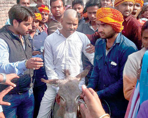 Bajrang Dal members assault Christian man, tonsure half his head, made to sit him on donkey and pass two police outposts unscathed 