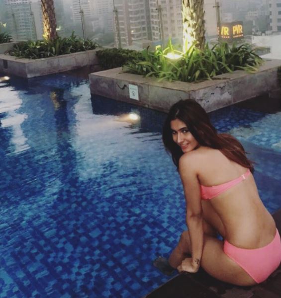 karishma Sharma’s Bikini Avatar, again showing the side of the pool