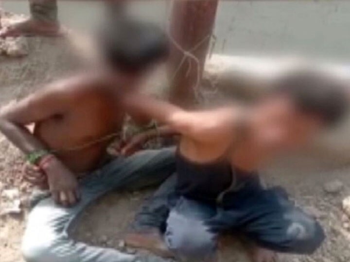 चोरी के शक में दो लोगों को बिजली के खंबे से बांध कर पीटा, वीडियो वायरल men tied to electric pole and beaten by auto drivers in noida